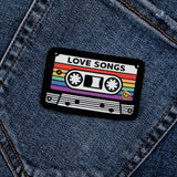 Love Songs pride patch on denim jeans, LGBT+